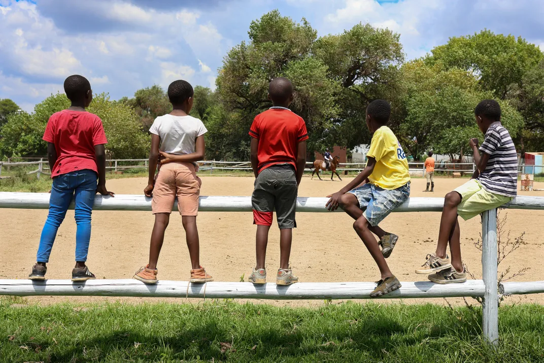 Curious neighborhood children at Mafokate’s riding center.