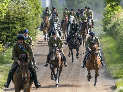 Riders gallop during the Hawick Common Riding in Scotland.