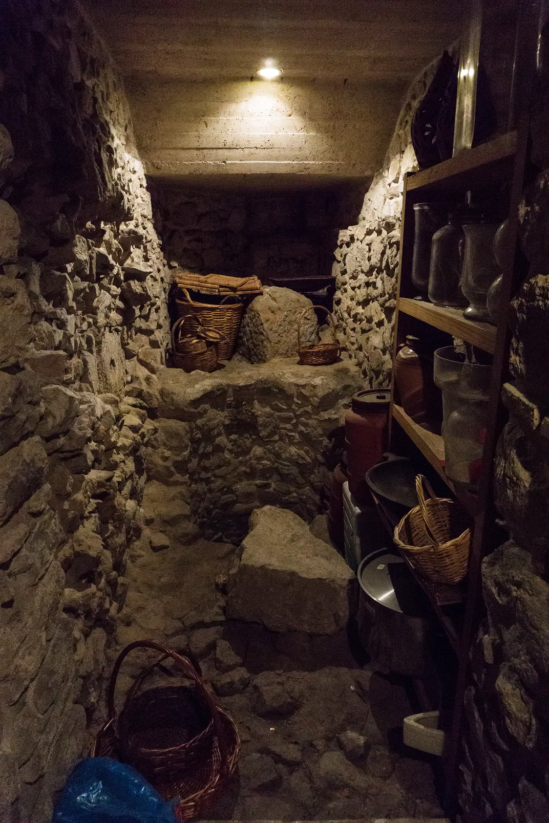 A well hidden in the cellar of the Carras family's home