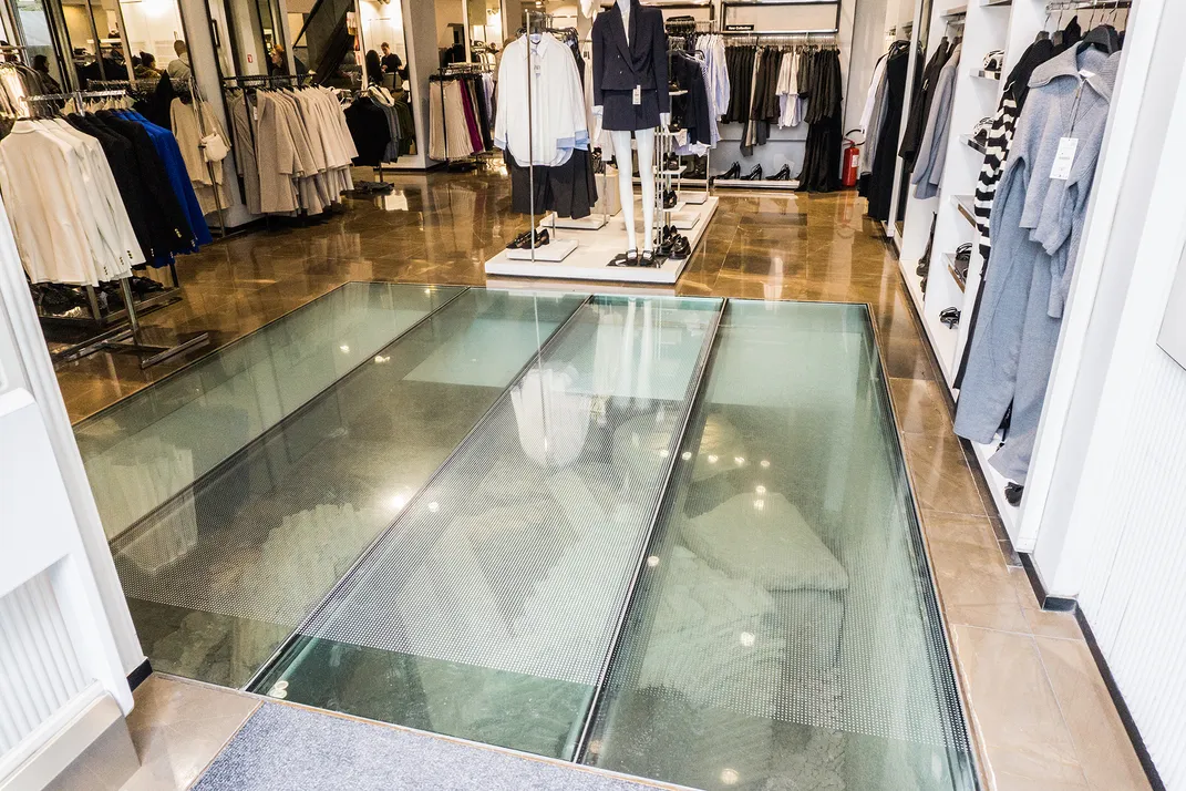 A Roman tomb under the glass floor of a clothing store